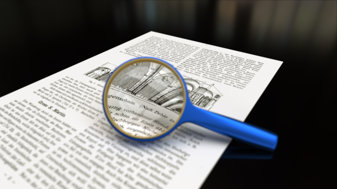 1024px-Magnifying_glass_with_focus_on_paper